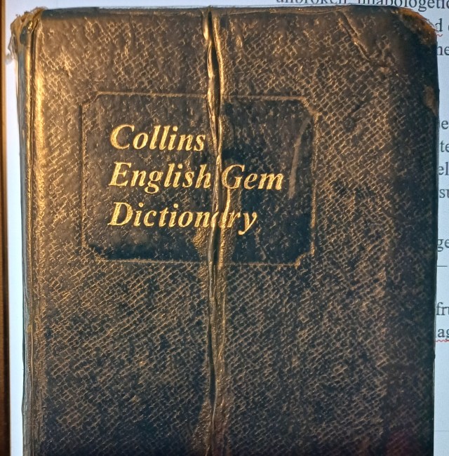 cover of a very old miniature dictionary, the Collins English Gem